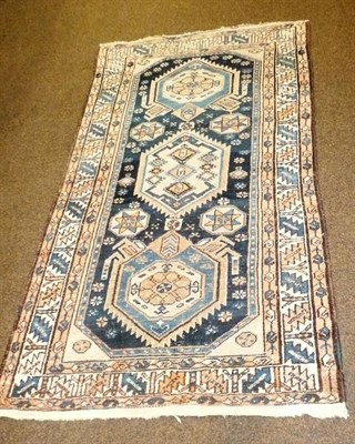 Lot 514 - A small brown rug