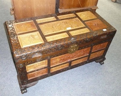 Lot 583 - A carved camphor wood box