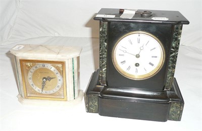 Lot 6 - A black slate and green marble mantel clock and a white marble and malachite clock (2)