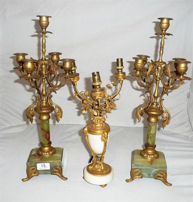Lot 15 - A pair of onyx and gilt metal candelabra and another (3)