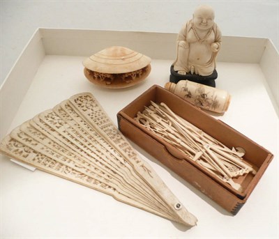Lot 71 - Carved ivory scent bottle, a fan, carved shell, ivory Buddha and carved bone toothpicks (5)