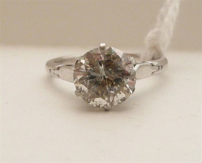 Lot 74 - A diamond solitaire ring, the round brilliant cut diamond in a white six claw setting to...