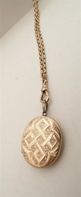 Lot 75 - A 9ct gold muff chain (19gms) and a gold-plated locket