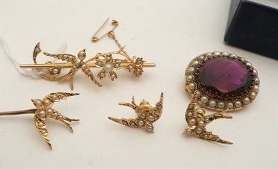 Lot 83 - A 15ct gold and seed pearl swallow bar brooch, stick pin and pair of earrings and a garnet and...