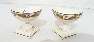 Lot 93 - A pair of 19th century creamware pedestal salts