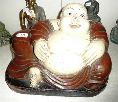 Lot 135 - A carved wooden Buddha figure