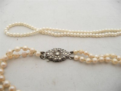 Lot 187 - A two strand cultured pearl necklace and a single strand necklace