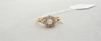 Lot 192 - An opal and diamond cluster ring