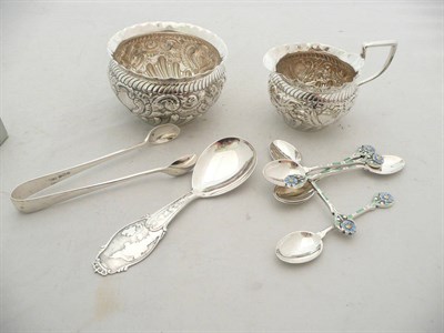 Lot 197 - Set of six silver and enamel teaspoons, a pair of sugar nips, an embossed silver jug and sugar bowl