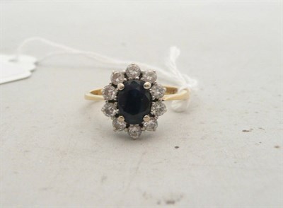 Lot 199 - A sapphire and diamond cluster ring