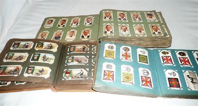 Lot 225 - Three albums of assorted cigarette cards