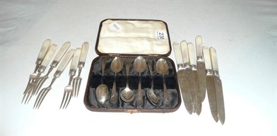 Lot 238 - Six silver tea spoons and a set of six silver and mother of pearl dessert knives and forks