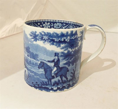 Lot 241 - A 19th century pearlware blue and white mug with hare coursing decoration