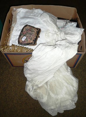 Lot 312 - Box of assorted textiles, children's gowns, etc