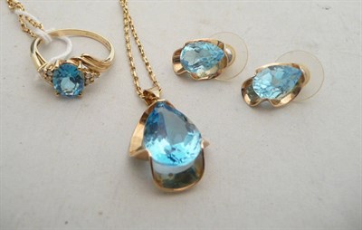 Lot 324 - A set of blue topaz jewellery, a ring, a pair of earrings and a pendant on chain