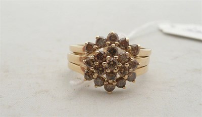 Lot 325 - A 9ct gold trio of rings set with diamonds