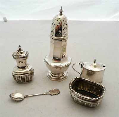 Lot 333 - A silver caster, silver salt, pepper and mustard and a spoon