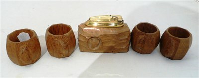 Lot 342 - Four Mouseman napkin rings and a table lighter