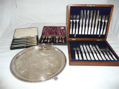 Lot 370 - Silver plate including a circular tray, cased spoons with tongs, cased mother-of-pearl handled...