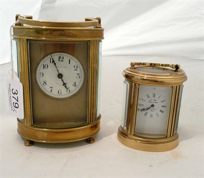 Lot 379 - Two oval section carriage clocks