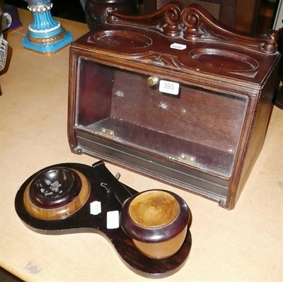 Lot 393 - Smoker's stand modelled as a giant pipe and a carved oak cigar display case (2)