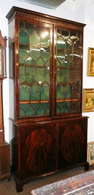 Lot 461 - A George III mahogany glazed cabinet