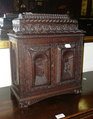 Lot 480 - A carved oak table cabinet (probably Colonial)