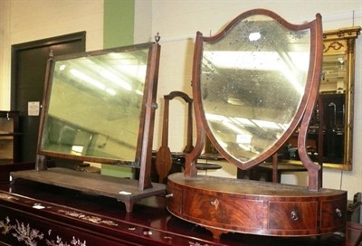 Lot 495 - A 19th century mahogany bow front shield-shape dressing mirror and another