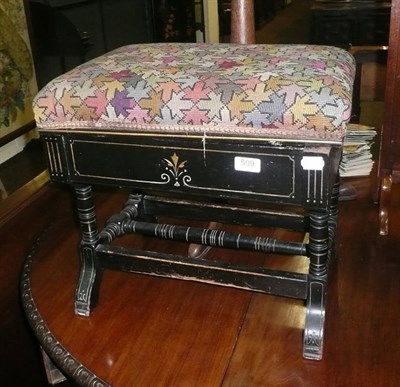 Lot 509 - An ebonised piano stool