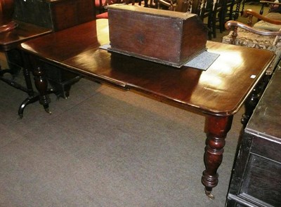 Lot 528 - A mahogany dining table