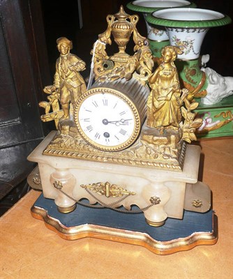 Lot 537 - A gilt metal and onyx mantel timepiece