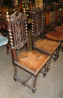 Lot 556 - A pair of carved oak side chairs