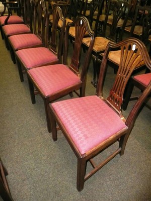 Lot 559 - A set of seven late George III mahogany dining chairs including a single carver