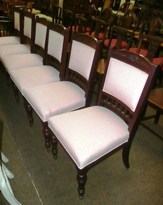 Lot 561 - A set of six dining chairs