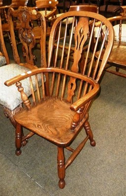 Lot 571 - An ash and elm Windsor armchair