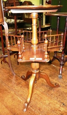 Lot 596 - Walnut tripod table with shaped under tier