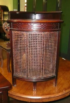 Lot 602 - A caned and mahogany corner stick stand