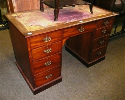 Lot 603 - A late Victorian mahogany knee hole pedestal desk (leather distressed)