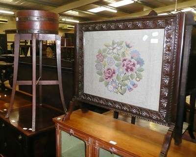 Lot 611 - Oak jardiniere and stand and a woolwork fire screen