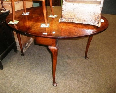 Lot 617 - A burr walnut drop-leaf table