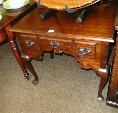 Lot 641 - A reproduction lowboy