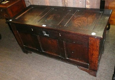 Lot 644 - A 17th century oak three panel coffer with double lock (later feet)