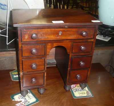 Lot 645 - A 19th century mahogany miniature kneehole desk