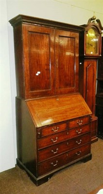 Lot 651 - George III oak bureau bookcase