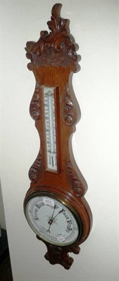 Lot 653 - Carved oak barometer