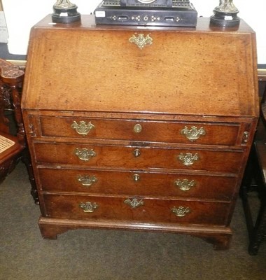 Lot 657 - George III oak bureau