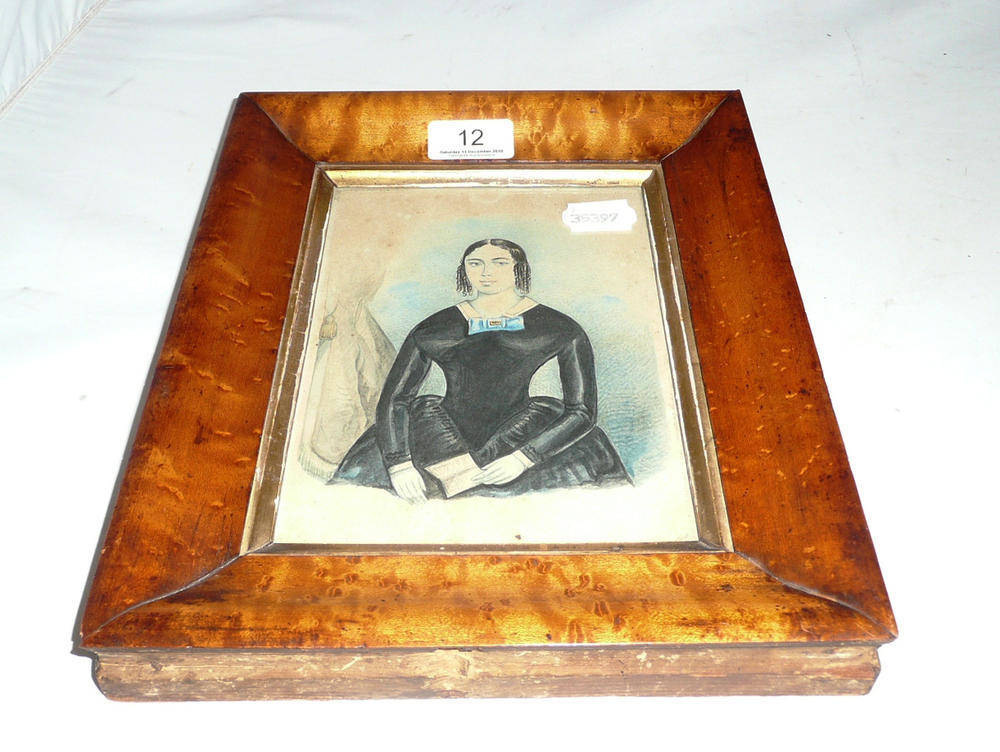 Lot 12 - A 19th century watercolour portrait of a lady in a maple frame