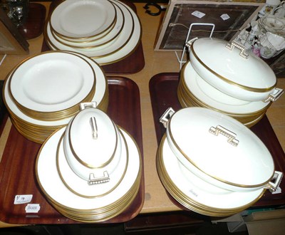 Lot 14 - A white and gilt decorated Cauldron dinner service (on three trays)