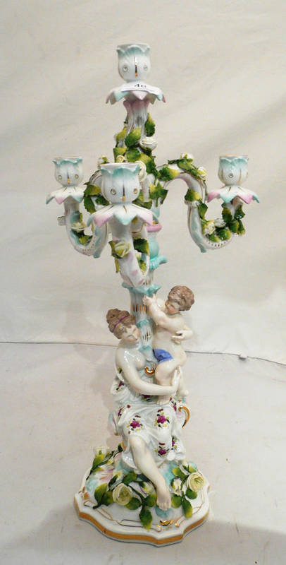 Lot 46 - A Continental porcelain three branch candelabrum