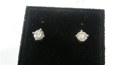 Lot 58 - A pair of diamond solitaire earrings, 0.20 carat approximately